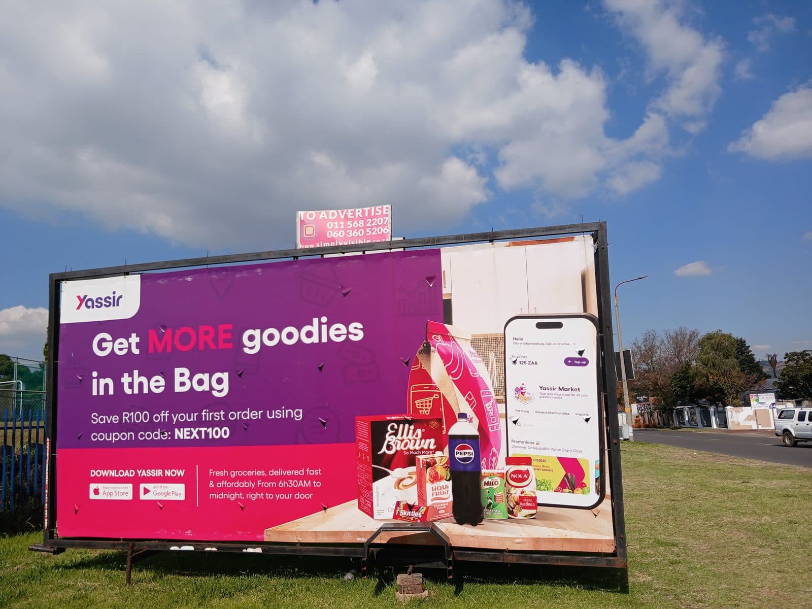 Yassir grocery delivery billboard on a Simply Visible trailer facing oncoming traffic